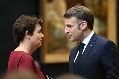 The director of the Louvre, Laurence Des Cars, talks with the French president, Emmanuel Macron, during her visit to the Louvre Museum.