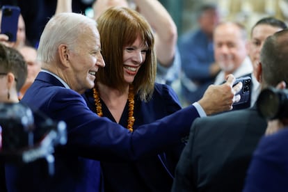 U.S. President Joe Biden takes a selfie with a person in Auburn, Maine, on July 28, 2023.