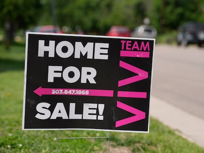 A for sale sign stands outside a single-family residence on Sunday, June 18, 2023, in Denver.