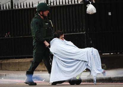 A medic moves the Portuguese man who was helped by Manuel Labrado after the attack.