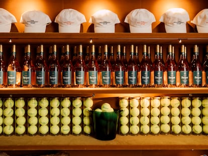 A corner of the fictional Rochambeau Club, with tennis balls and rosé wine.