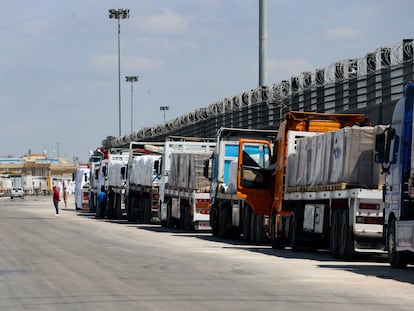 A line of trucks waits at the Egyptian side of the Rafah border crossing, which links Gaza to Egypt, March 23, 2024.