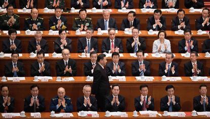 Aplausos al presidente chino Xi Jinping tras un discurso. 
