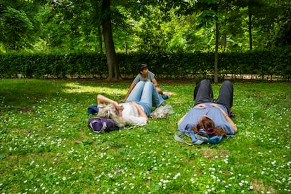 People relaxing in Retiro Park, Madrid, in May of last year.