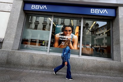 FILE PHOTO: A woman walks past a branch of Spain's BBVA bank in Bilbao, Spain, May 13, 2024. REUTERS/Vincent West/File Photo