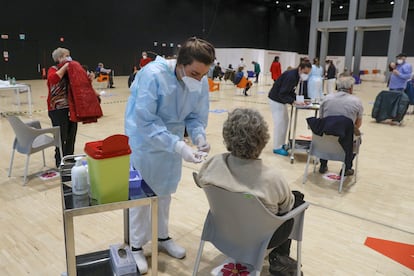 People receiving a dose of the AstraZeneca vaccine in Rome, Italy.