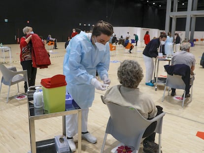 People receiving a dose of the AstraZeneca vaccine in Rome, Italy.