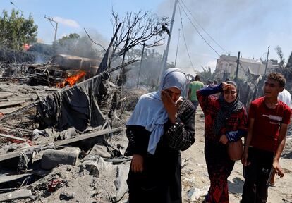 Two women cry after the Israeli attack in Al Mawasi, west of Khan Yunis, on Saturday. 