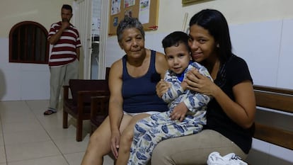 Venezuelan Susana Guevara, with one of her children, in Colombia.