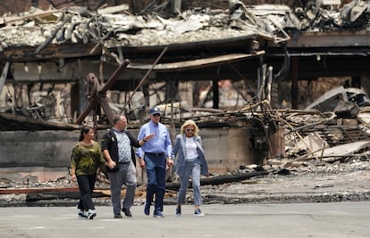 U.S. President Joe Biden and first lady Jill Biden walk with Hawaii Governor Josh Green as they tour the fire-ravaged town of Lahaina on the island of Maui in Hawaii, on August 21, 2023.
