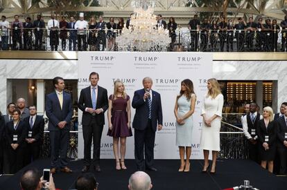 Trump with his wife and children at the inauguration of his Washington hotel in October.