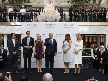 Trump with his wife and children at the inauguration of his Washington hotel in October.