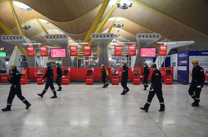 Military Emergency Unit members disinfecting Madrid's Adolfo Suarez Barajas Airport.