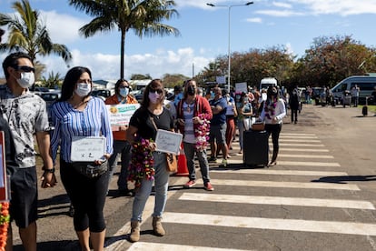 Residents of Easter Island await the arrival of new tourists at the airport.