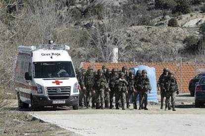 An ambulance at the scene of the army engineering academy in Hoyo de Manzanares, Madrid. Five soldiers died during an exercise involving explosives.