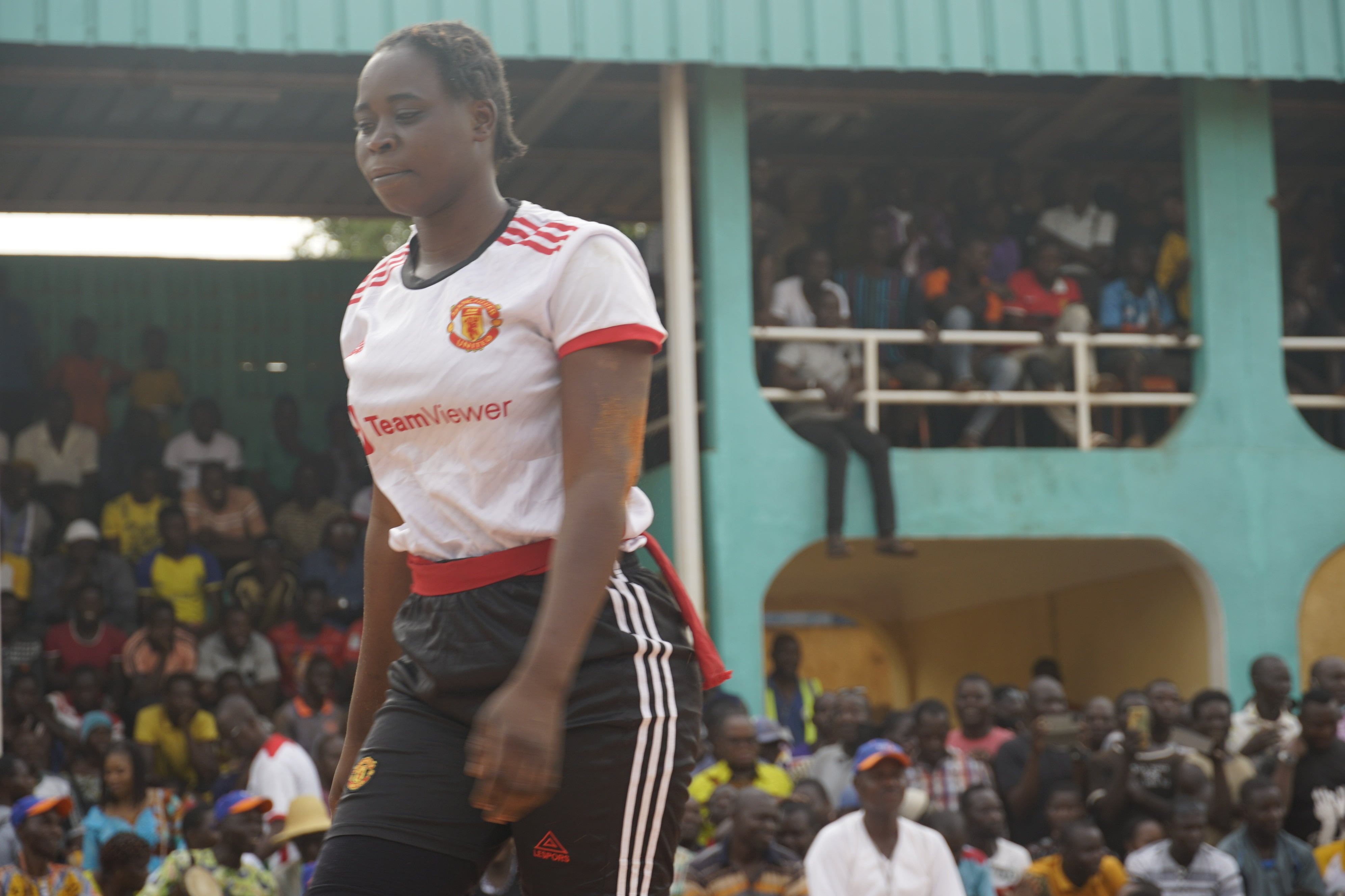 Kadiata Tamboura finishes a bout at the traditional fighting competition during the National Culture Week in Bob-Dioulasso on May 2.