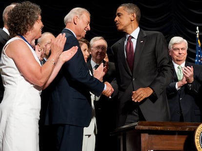 Former president Barack Obama shakes hands with current U.S. President Joe Biden in July 2010 after signing the Dodd-Frank Wall Street Reform and Consumer Protection Act.