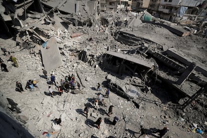 Palestinians inspect the site of an Israeli bombing in Jabalia, northern Gaza, on Tuesday.