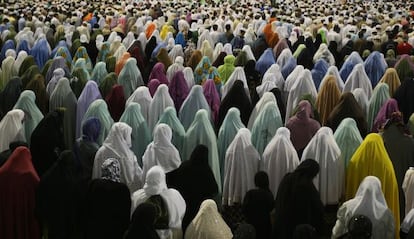 Muslim women pray outside the Great Mosque in Mecca in 2009.