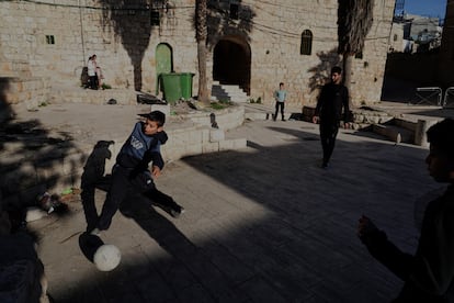 Palestinian children play in the old area of Hebron.