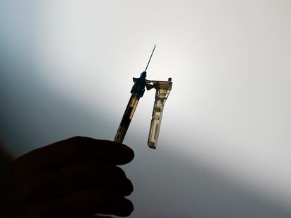 A syringe is prepared at a clinic in Norristown, Pennsylvania, on December 7, 2021.