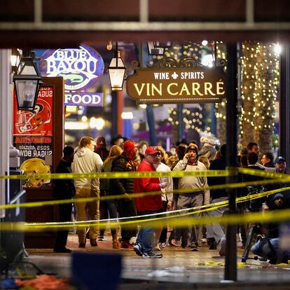 People stand near the site where people were killed by a man driving a truck in an attack during New Year's celebrations, in New Orleans, Louisiana, U.S., January 1, 2025.   REUTERS/Eduardo Munoz