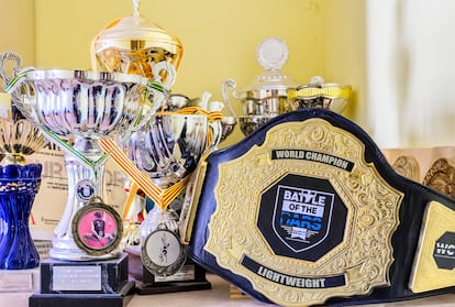 Jiménez's trophy collection, including the world champion belt. 