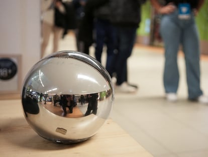 In Madrid, people line up in front of a Worldcoin iris-scanning orb.