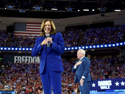 FILE PHOTO: U.S. Vice President and Democratic presidential nominee Kamala Harris reacts, while her running mate Minnesota Governor Tim Walz stands nearby, as she is filmed for a live broadcast into Chicago's Democratic National Convention (DNC), after delegates of each state delegation ended the roll call to once again nominate her as presidential nominee, during her rally in Milwaukee, Wisconsin, U.S. August 20, 2024. REUTERS/Kevin Lamarque/File Photo