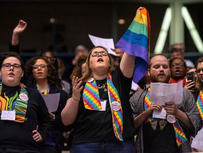 Shelby Ruch-Teegarden, center, of Garrett-Evangelical Theological Seminary, joins other protestors during the United Methodist Church's special session of the general conference in St. Louis, Tuesday, Feb. 26, 2019.