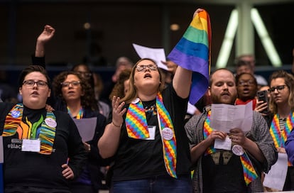 Shelby Ruch-Teegarden, center, of Garrett-Evangelical Theological Seminary, joins other protestors during the United Methodist Church's special session of the general conference in St. Louis, Tuesday, Feb. 26, 2019.