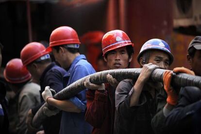 Trabajadores chinos en Pekín.