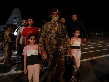 Jordanians evacuated from Sudan arrive at a military airport in Amman, Jordan, on April 24, 2023.
