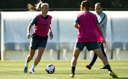 Tojni Duggan, junto al entrenador Lluís Cortés.