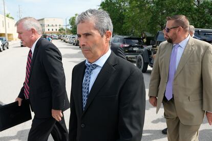 Carlos De Oliveira, center, property manager of former President Donald Trump's Mar-a-Lago estate