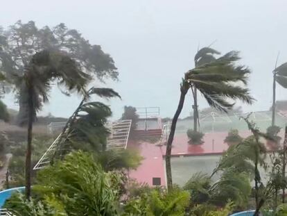 This video grab from the Twitter page of James Reynolds @EarthUncutTV shows tropical storm force winds blowing  across Tumon Bay, Guam on May 24, 2023.