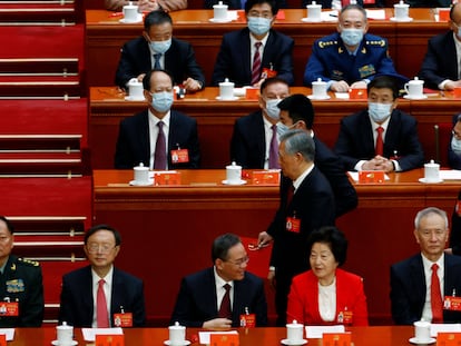 Former Chinese president Hu Jintao leaves his seat during the closing ceremony of the 20th National Congress of the Communist Party of China, at the Great Hall of the People in Beijing, China October 22, 2022. REUTERS/Tingshu Wang