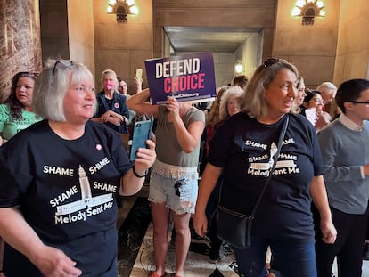 Pat Neal, left, and Ann Fintell, both of Lincoln, celebrate in the Nebraska Capitol