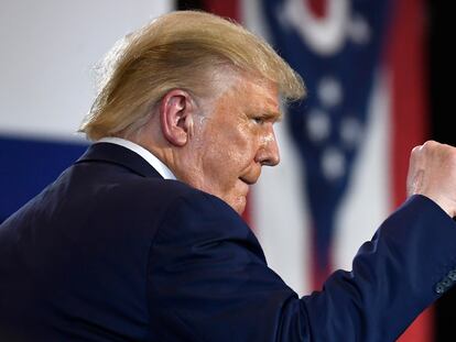 President Donald Trump pumps his fist as he finishes speaking during an event at the Whirlpool Corporation facility in Clyde, Ohio, Thursday, Aug. 6, 2020. (AP Photo/Susan Walsh)