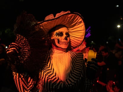 A woman dressed as Catrina in a Mexico City parade; October 22, 2023.