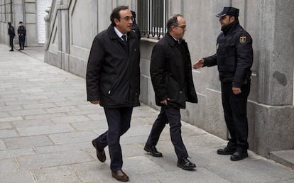 Los 'exconsellers' Jordi Turull (derecha) y Josep Rull llegan este viernes a la sede del Supremo, en Madrid.