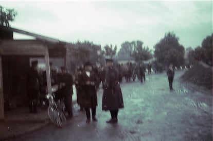 Jews from Oświęcim lining up to enter the city center, collect food rations, or attend some kind of registration by the occupation authorities.