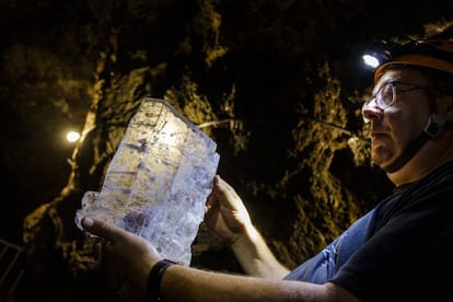 José Ángel Solanilla, a mining engineer, holds up gypsum crystal found inside Mina Rica.