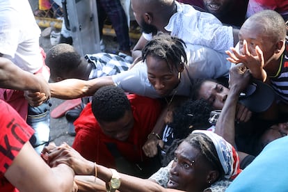 Migrants are crushed as they try to force their way into the asylum office in Tapachula, Mexico, on Sep. 18, 2023.