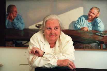 Literary agent Carmen Balcells poses in front of a portrait of her, by Gonzalo Goytisolo.