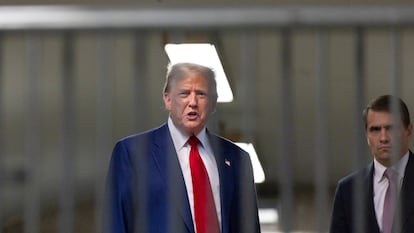 Donald Trump speaks to reporters as he leaves the courthouse where he is being tried in New York, April 30.