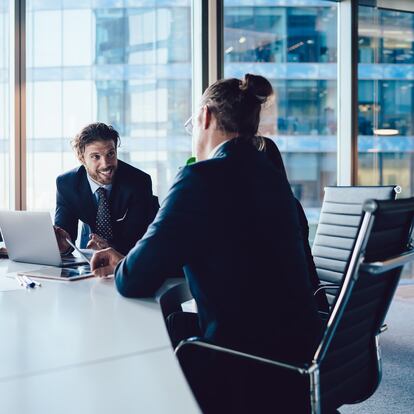 Successful male and female crew of financial experts have cooperation meeting at office table for discussing project planning, professional executive managers consultancy and brainstorming in firm