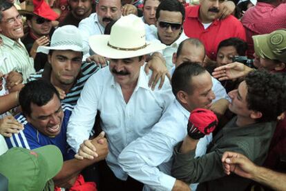 Former president Manuel Zelaya is greeted by supporters on his return to Tegucigalpa.