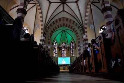 People attend an AI generated church service in Nuremberg, Germany
