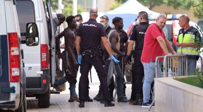 Some of the migrants who crossed into Melilla on Sunday are escorted by the police.